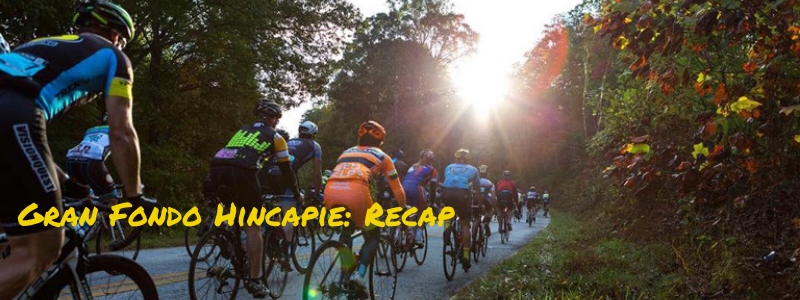 Bikes riding on a road surrounded by trees, text "Gran Fondo Hincapie: Recap"