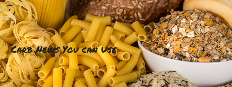 Pasta, bread and grains on table, text "Carb news you can use"