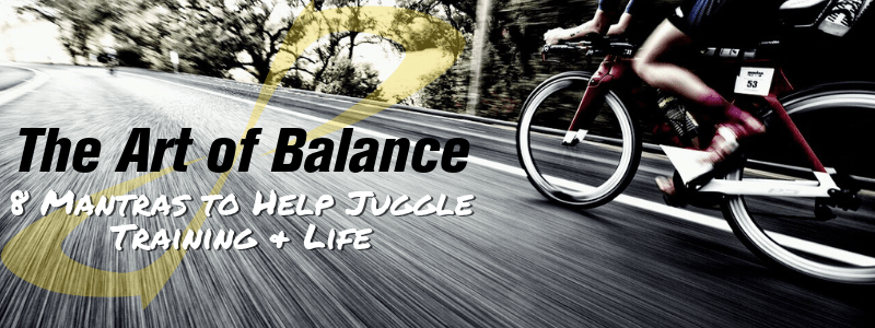 Person riding bike on the street quickly, text "The Art of Balance, 8 Mantras to help juggle life and training"