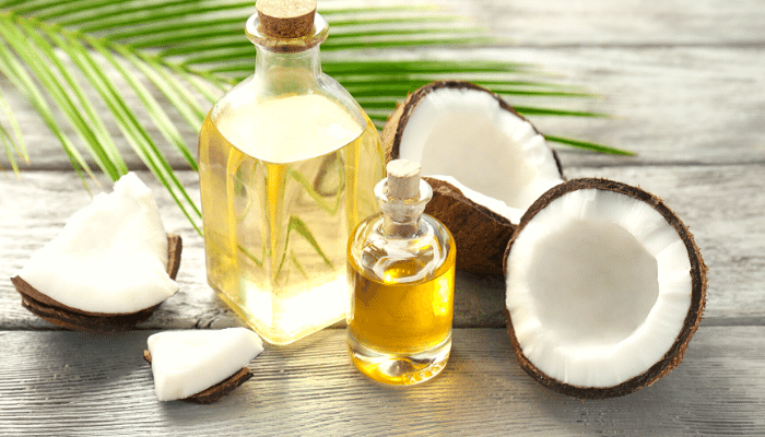 MCT oil next to a coconut